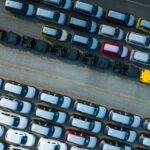 aerial-view-a-lot-of-new-car-for-import-and-export-2024-12-08-00-33-50-utc (1)