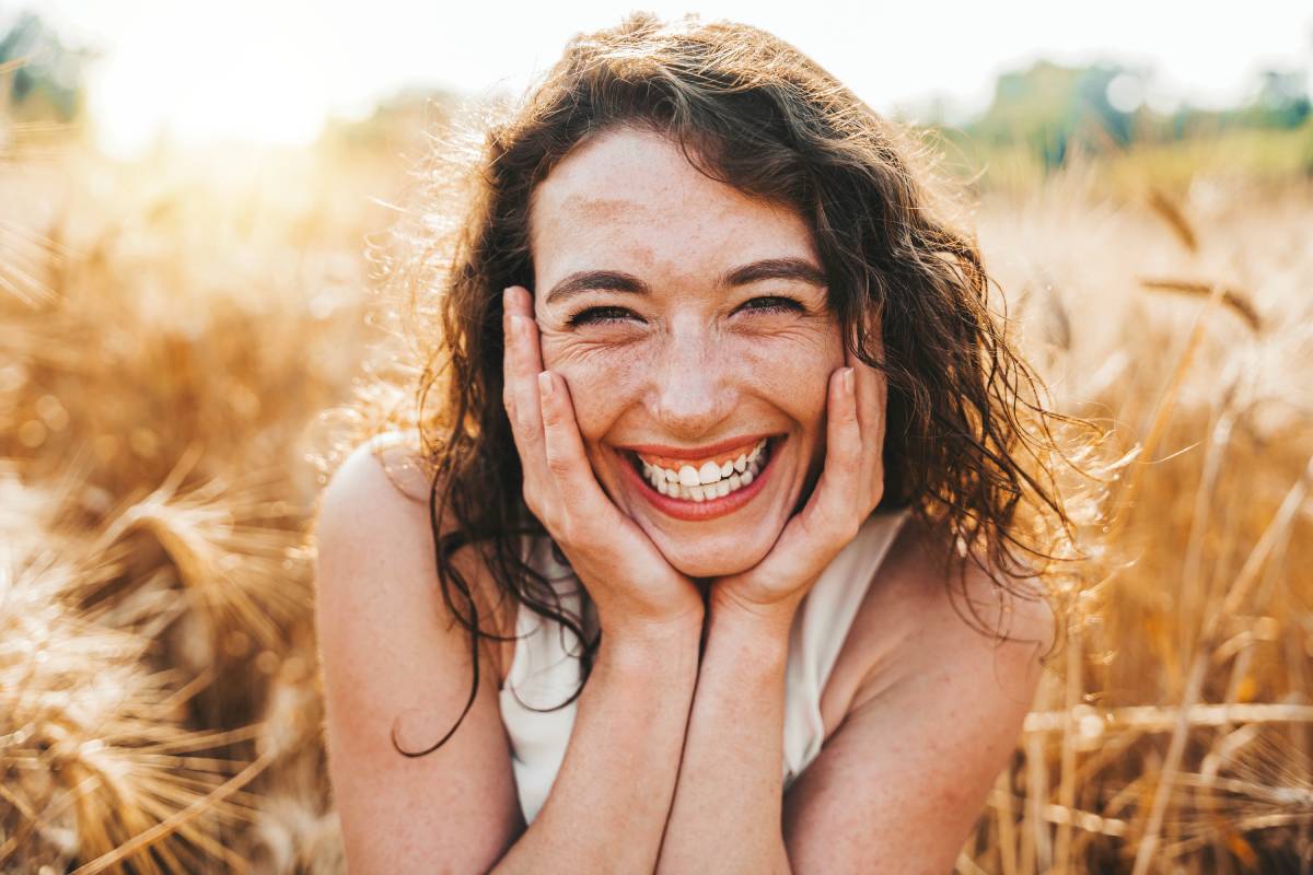 happy-beautiful-woman-smiling-at-camera-in-a-wheat-2025-02-10-07-55-15-utc (1)