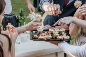 group-of-friends-eating-finger-food-at-a-Catering wedding-r-2025-03-09-04-13-50-utc (1)