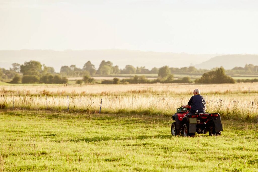  a wick wiper tool attached to a quad bike